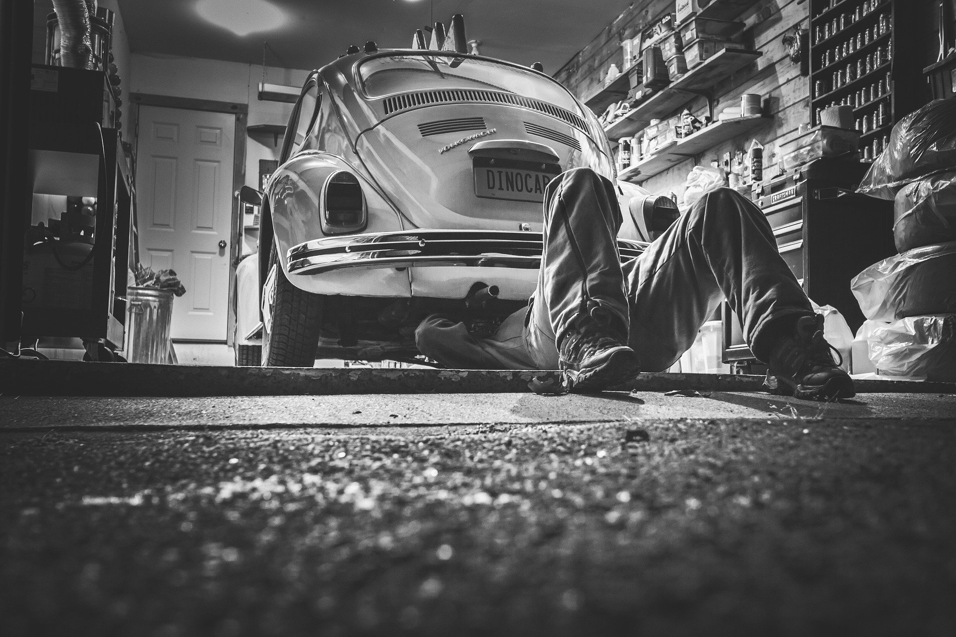 Mechanic working on car.