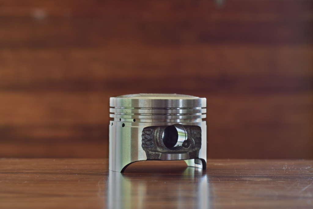 Piston on table.